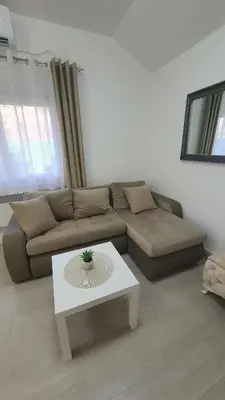 a living room with a couch and a coffee table at Smile 1 in Belgrade