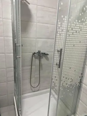 a shower with a glass door in a bathroom at Smile 1 in Belgrade