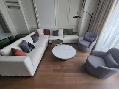 a living room with a white couch and two chairs at Exclusive apartman Belgrade Waterfront Terraces - Unique in Belgrade
