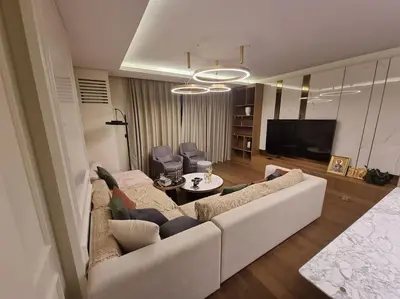 a living room with a couch and a table at Exclusive apartman Belgrade Waterfront Terraces - Unique in Belgrade