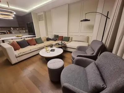 a living room with couches and chairs and a table at Exclusive apartman Belgrade Waterfront Terraces - Unique in Belgrade