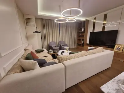 a living room with a couch and a tv at Exclusive apartman Belgrade Waterfront Terraces - Unique in Belgrade