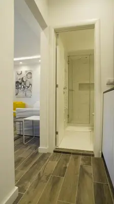 a room with a shower and a glass door at Friendly Home ap Balkan-inn in Belgrade