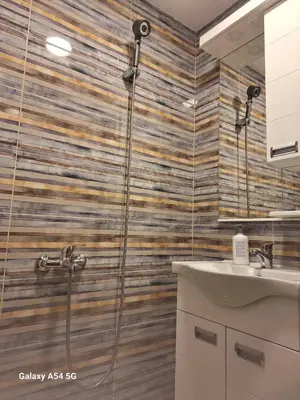 a bathroom with a shower and a sink at Dream 5 in Belgrade