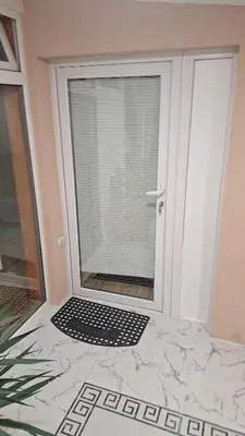 a glass door with a black and white mat in front at Dream 5 in Belgrade