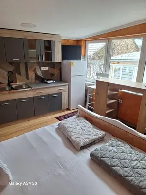 a kitchen with a large bed in a room at Dream 6 in Belgrade