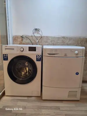 a dryer and a washing machine in a room at Dream 6 in Belgrade