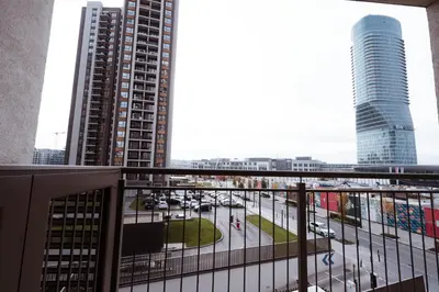 a view from the balcony of a building with tall buildings at inJoy in Belgrade