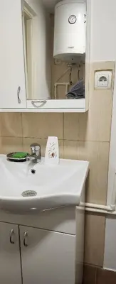 a bathroom with a white sink and a mirror at Kristian in Belgrade