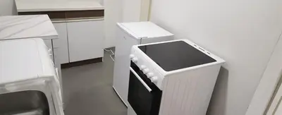a kitchen with a white refrigerator with a stove at Kristian in Belgrade
