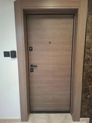 a wooden door in a room at Stef Lux Apartments in Belgrade