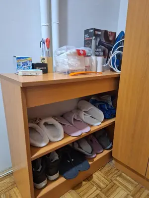 a closet with a bunch of shoes in it at Toni apartment in Belgrade