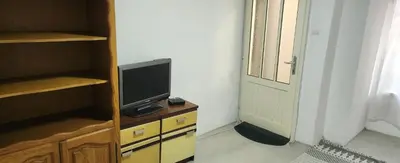 a tv sitting on a dresser in a room at Kristian 1 in Belgrade