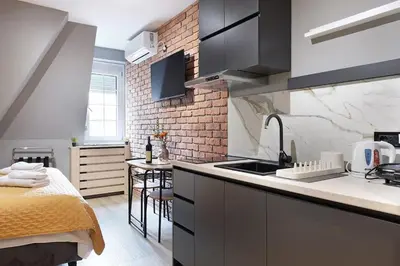 a kitchen with a sink and a counter top at Apartment Paradise Slavija Tres in Belgrade