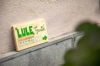 a sign on the side of a building at Lule garden apartment in Belgrade