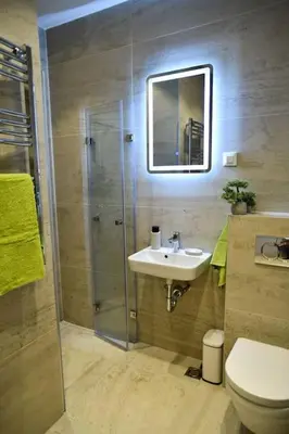 a bathroom with a shower and a sink and a toilet at Present Perfect Stay in Belgrade