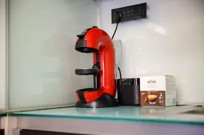 a red mixer sitting on top of a counter at Emma in Belgrade