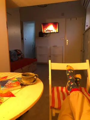 a pair of socks sitting on a chair next to a table at Oblak in Belgrade