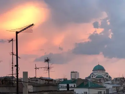 a view of a city skyline with a sunset at Oblak in Belgrade