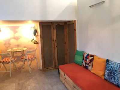 a living room with a couch and a table at Oblak in Belgrade