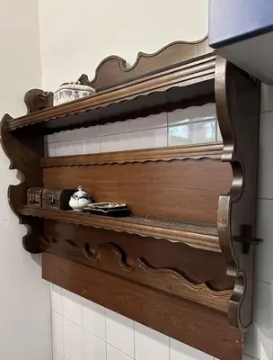 a wooden shelf on the wall in a kitchen at Lilly's Apartment in Belgrade