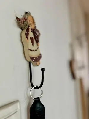 a vase attached to a wall with a decoration on it at Surya in Belgrade