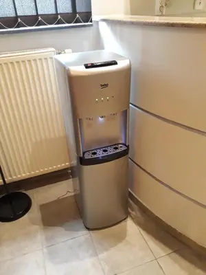 a small refrigerator in a kitchen next to a counter at Njegoševa Presidential Suite Vračar in Belgrade