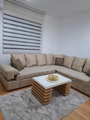 a living room with a couch and a table at Gala Lux Lazarevac in Lazarevac