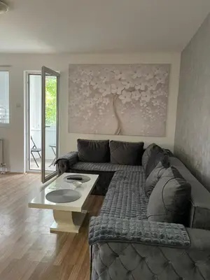 a living room with a couch and a table at Leyla Lux in Bele Vode