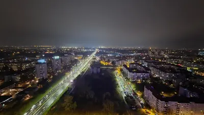 a city lit up at night with traffic at Genex SPA in Belgrade