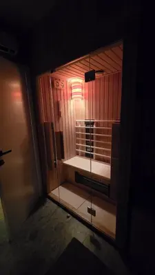 a room with a glass door and a room with access at Genex SPA in Belgrade