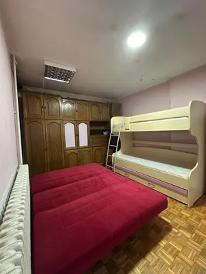 a room with two bunk beds and a red blanket at Apartment Ruby in Belgrade