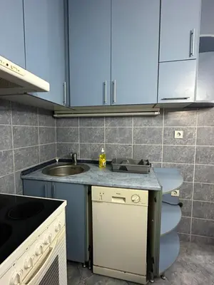 a kitchen with a sink and a toilet at Apartment Ruby in Belgrade