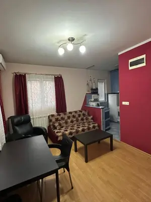 a living room with a couch and a table at Apartment Ruby in Belgrade