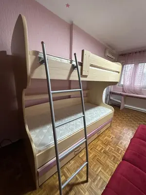a bunk bed with a ladder in a room at Apartment Ruby in Belgrade
