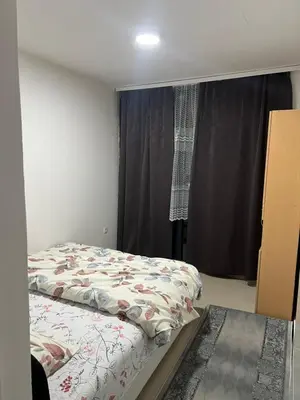 a small bedroom with a bed and a window at Melvina in Pančevo