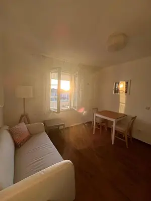a living room with a couch and a table at Pevac, Rooster, apartment in Belgrade