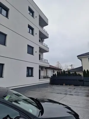 a car parked in front of a building at Lux apartmani na Ledinama in Ledine