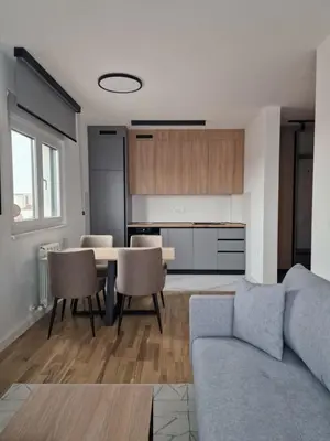 a living room with a couch and a table at Lux apartmani na Ledinama in Ledine