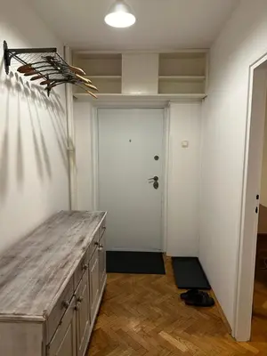 a room with a wooden counter and a white door at Kalenić Sky in Belgrade