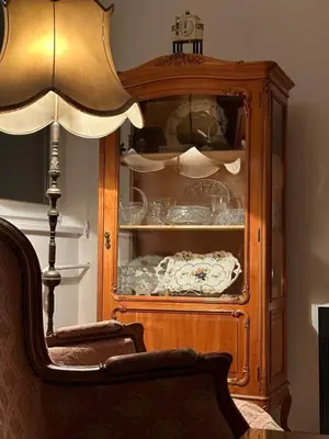 a wooden cabinet with dishes in it in a room at Kalenić Sky in Belgrade