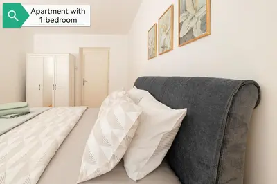 a bedroom with a couch and two pillows at Top House Belgrade in Belgrade