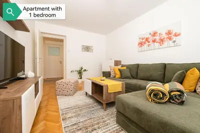 a living room with a couch and a tv at Top House Belgrade in Belgrade