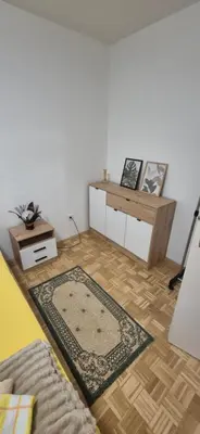 a living room with a couch and a table at Two Sister in Belgrade