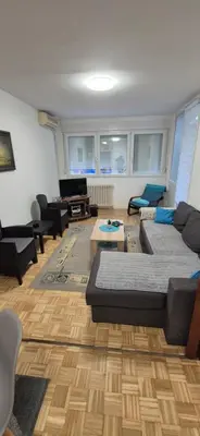 a living room with a couch and a table at Two Sister in Belgrade