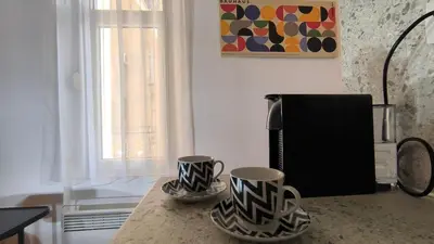 two mugs sitting on a counter in a kitchen at Center 1 Queen bed Sofa Additional living area in Belgrade