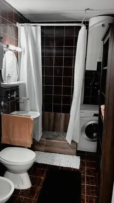 a bathroom with a toilet and a sink and a shower at Stan ARS in Belgrade
