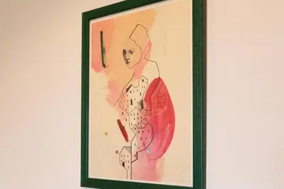 a painting of a woman in a red dress at Charming Duplex in Belgrade in Belgrade