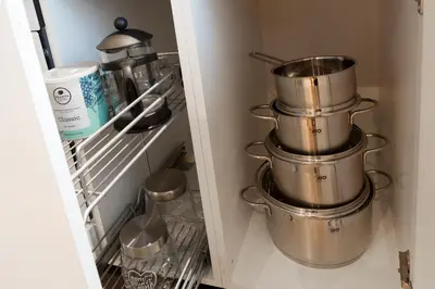 a group of pots and pans in a refrigerator at Charming Duplex in Belgrade in Belgrade