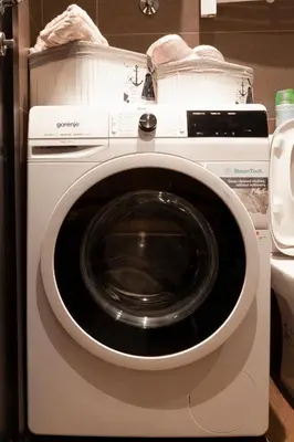 a white washing machine with its door open at Charming Duplex in Belgrade in Belgrade